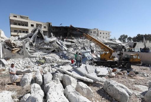 المباني المدمرة نتيجة انفجار مستودع أسلحة في محافظة إدلب، شمالي سوريا، 12 أغسطس 2018. أ ف ب 