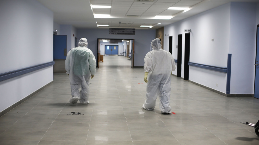 أطباء يرتدون معدات واقية من فيروس كورونا في مستشفى البشير. (صلاح ملكاوي / المملكة)