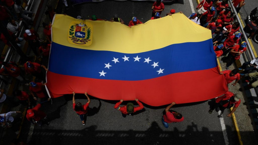 أنصار الرئيس الفنزويلي نيكولاس مادورو يشاركون في مسيرة لدعم الحكومة . فنزويلا. 13 يوليو 2019. أ ف ب