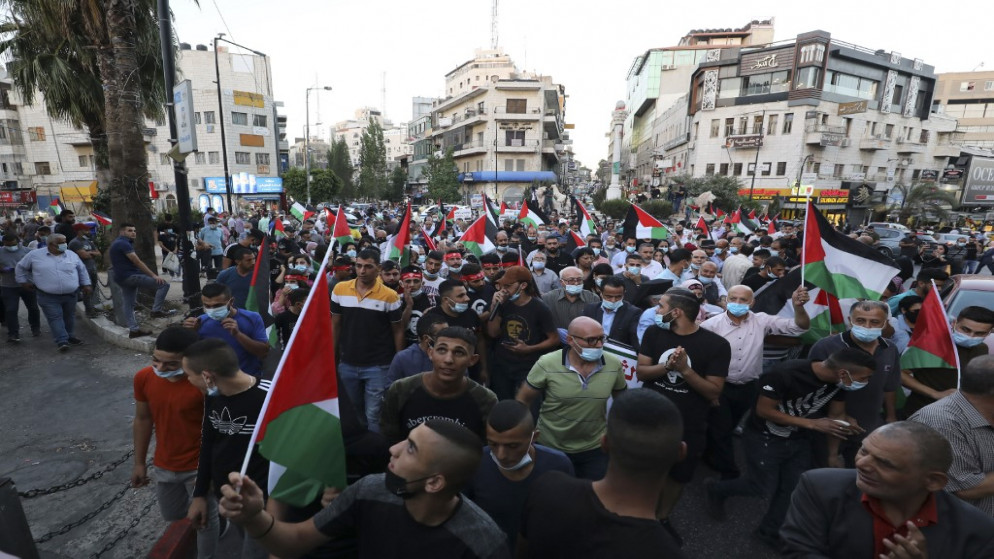 فلسطينيون خلال إحياء الذكرى 20 لانتفاضة الاقصى .رام الله في الضفة الغربية المحتلة .28 سبتمبر 2020. (أ ف ب)