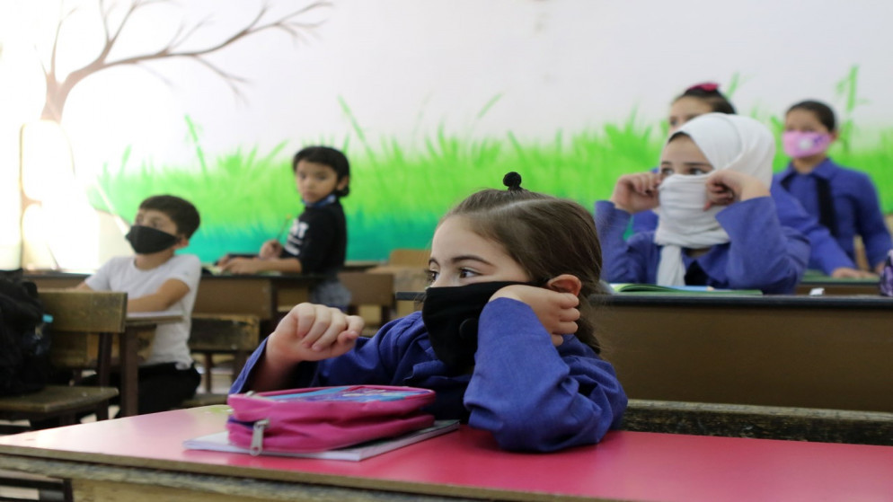 طلاب يرتدون الكمامات في إحدى المدارس في عمان. (صلاح ملكاوي /المملكة)