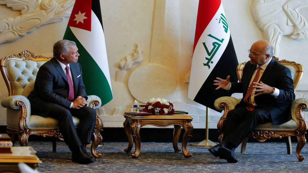 جلالة الملك عبدالله الثاني مع الرئيس العراقي برهم صالح. (رويترز)