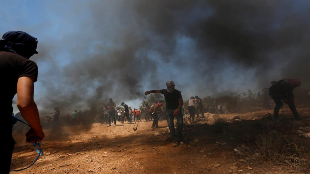 جانب من مواجهات بين فلسطينيين وجنود الاحتلال الإسرائيلي بالقرب من جبل صبيح في قرية بيتا جنوب مدينة نابلس، 2/7/2021 (وفا)