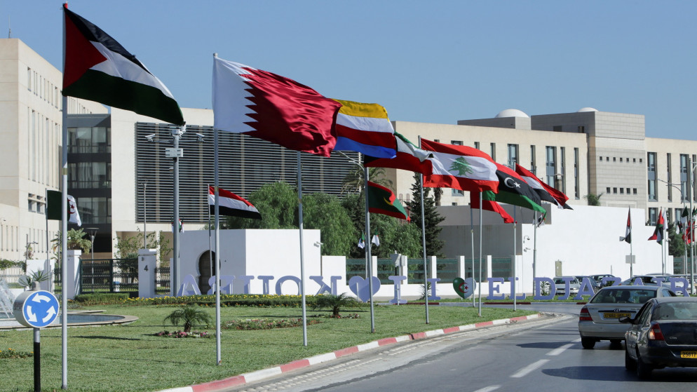 أعلام دول عربية في شارع عام في الجزائر قبيل انعقاد القمة العربية. (أ ف ب)