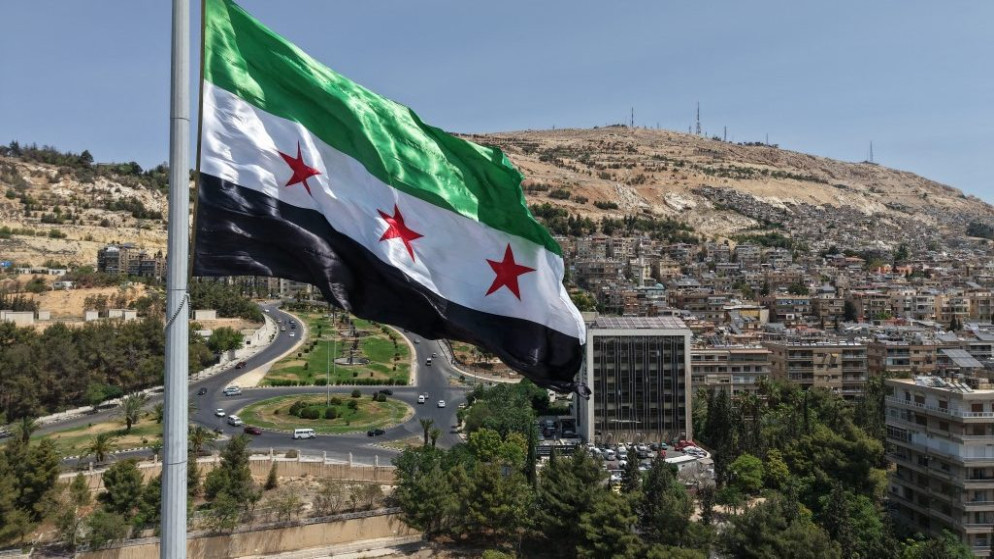 العلم السوري في دمشق. (أ ف ب)