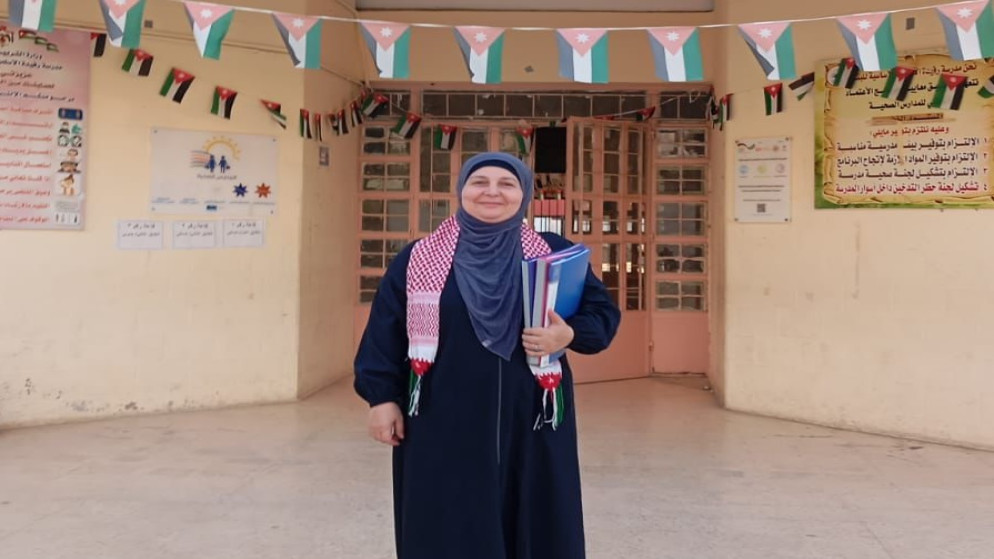 إيمان الرفاعي،  متطوعة في مدرسة رفيدة الأسلمية الأساسية المختلطة التابعة لقصبة محافظة إربد